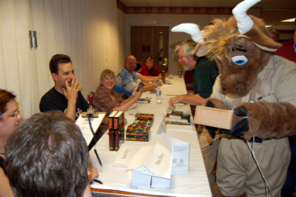 Authors at a long table