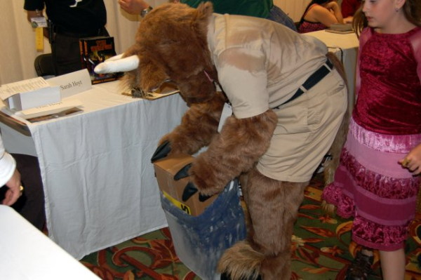 Orvan pulls a large parcel from a sack