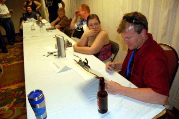 Doc Travis looking at clipboard