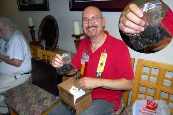 Stephen Cobb with a bag of burnt chicken bones.