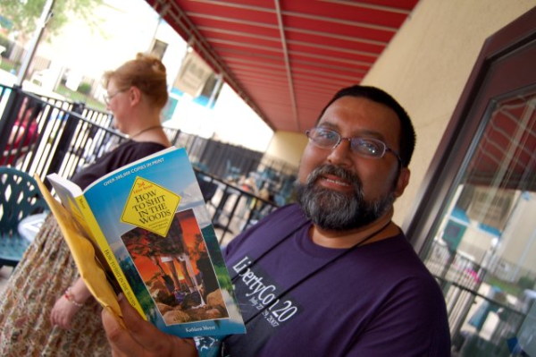 Bear, smiling, with book