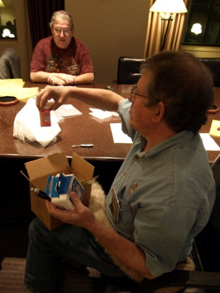 guy looking at a pill bottle