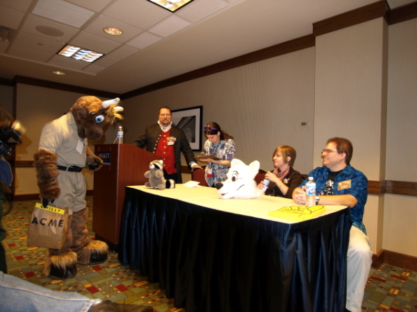 Chilly signs as other panelists and moderator watch.