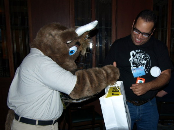 Orvam giving Stego an ACME bag