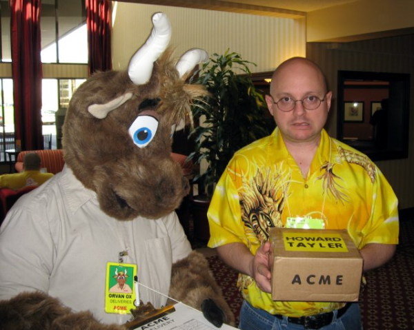 Worried Howard Tayler holding a parcel