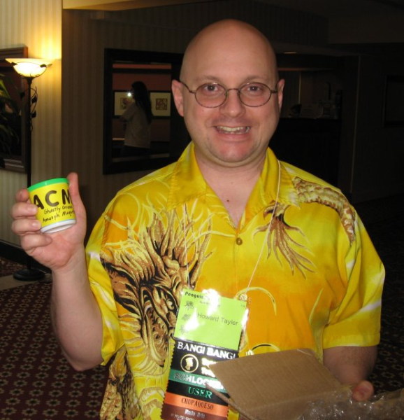 Howard holding a small container