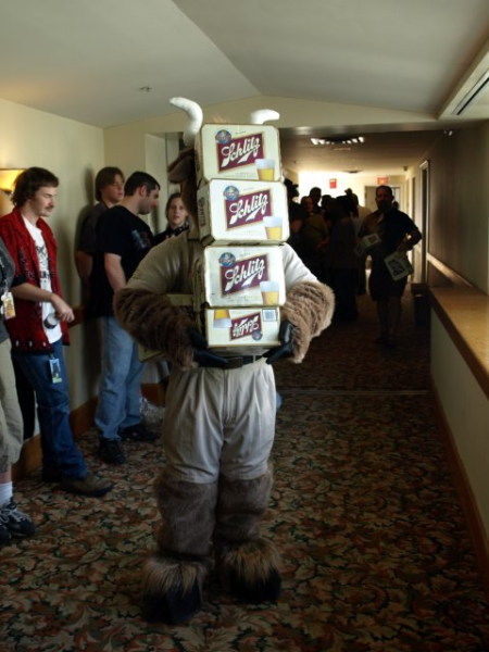 orvan holding a stack of schlitz cases