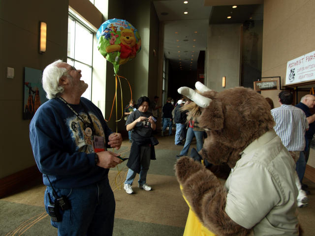 BJ laughing with a Winnie the Pooh balloon