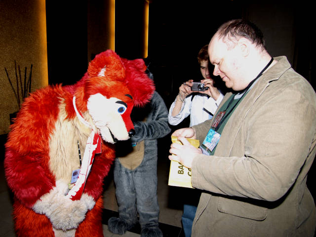 Cola opening the envelope.