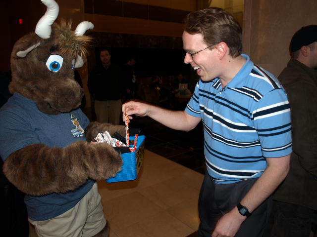 Happy person taking a pice of Cow Tales candy