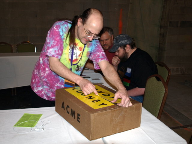 Andy cutting a box open.