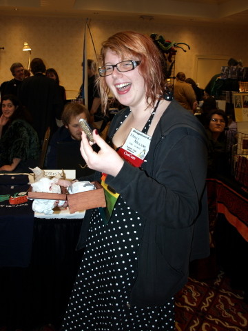 Molly holding up a steampunkish pocket knife