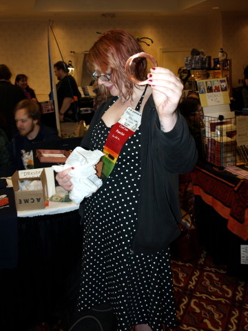 Molly holding a coil of copper wire