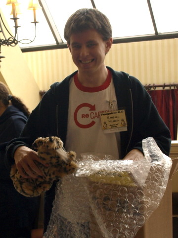 Randall Munroe holding a bobcat.