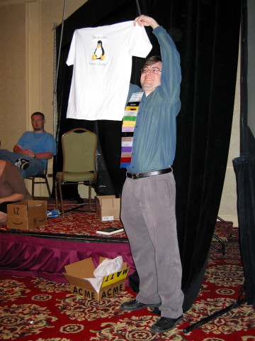 Matt Arnold holding up a shirt.