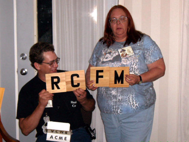 KO and PITA holding big tiles that read 'RCFM'