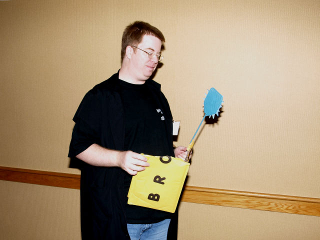 Brody holding a flyswatter